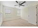 Bedroom with two windows with blinds, a ceiling fan, and carpet flooring at 6080 Indian Wood Se Cir, Mableton, GA 30126