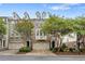 A row of townhouses with brick facades, lush landscaping, and attached one car garages at 6080 Indian Wood Se Cir, Mableton, GA 30126