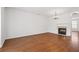 Expansive living room featuring a fireplace, chandelier, and beautiful hardwood flooring at 6080 Indian Wood Se Cir, Mableton, GA 30126