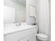 Clean bathroom featuring a white vanity, modern fixtures, and a neutral color scheme at 610 Belshire Dr, Acworth, GA 30102