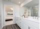 Bathroom featuring double sink and a walk-in shower with a bedroom in the background at 610 Belshire Dr, Acworth, GA 30102