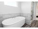 Bathroom featuring soaking tub and a walk-in shower at 610 Belshire Dr, Acworth, GA 30102