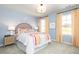 Sunlit bedroom with rainbow decor, complemented by modern furnishings and natural light streaming through the windows at 610 Belshire Dr, Acworth, GA 30102