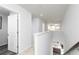 Upstairs hallway overlooking the kitchen, providing natural light and a view of the downstairs living area at 610 Belshire Dr, Acworth, GA 30102