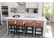 Kitchen featuring a large island with bar stool seating, pendant lighting, and modern appliances at 610 Belshire Dr, Acworth, GA 30102