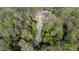 Stunning aerial view of an estate featuring lush landscaping, a pond, and a circular driveway leading to the beautiful home at 4615 Northside Dr, Atlanta, GA 30327