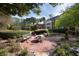 Enjoy the lush backyard with a brick patio, mature landscaping, and a serene garden area at 4615 Northside Dr, Atlanta, GA 30327