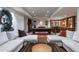 Spacious basement living room with a pool table, a custom bar, and comfortable seating at 4615 Northside Dr, Atlanta, GA 30327