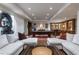 Spacious basement features a living room, game tables, and bar at 4615 Northside Dr, Atlanta, GA 30327