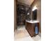 Bathroom featuring a tiled walk-in shower and a wooden vanity with a vessel sink at 4615 Northside Dr, Atlanta, GA 30327