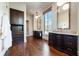 Bathroom with marble countertops, dark wood cabinets, and hardwood floors at 4615 Northside Dr, Atlanta, GA 30327