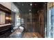 Modern bathroom features tiled walk-in shower, floating bench, with marble counter-tops and vanities at 4615 Northside Dr, Atlanta, GA 30327