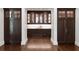 Butler's pantry with dark wood cabinetry, bar area, and decorative lighting at 4615 Northside Dr, Atlanta, GA 30327