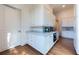 This butler's pantry provides ample storage with white cabinets, granite countertops, and stainless steel appliances at 4615 Northside Dr, Atlanta, GA 30327