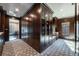 Luxurious walk-in closet boasts custom wood cabinetry with ample storage and display shelving at 4615 Northside Dr, Atlanta, GA 30327