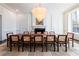 Bright dining room showcasing contemporary chandelier and ample seating for large gatherings at 4615 Northside Dr, Atlanta, GA 30327