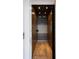 Residential elevator with wooden floor and walls, offering convenience and accessibility at 4615 Northside Dr, Atlanta, GA 30327