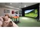 Entertainment room has a large projector screen and putting green at 4615 Northside Dr, Atlanta, GA 30327
