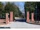 Elegant brick entrance with iron gate adds sophistication and security to the property's exterior at 4615 Northside Dr, Atlanta, GA 30327