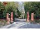 Wrought iron entry gate with brick pillars, providing privacy and curb appeal at 4615 Northside Dr, Atlanta, GA 30327
