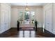 Elegant foyer featuring a herringbone-patterned hardwood floor, white walls, and double-door entry at 4615 Northside Dr, Atlanta, GA 30327