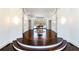 Grand foyer showcasing a circular design, hardwood floors, and natural light at 4615 Northside Dr, Atlanta, GA 30327