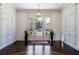 Bright foyer featuring neutral walls, elegant chandelier, and beautiful floors at 4615 Northside Dr, Atlanta, GA 30327