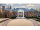 A luxurious brick mansion with manicured lawns and landscaping at 4615 Northside Dr, Atlanta, GA 30327