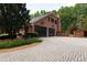 Two-car garage with sleek glass doors and a spacious driveway at 4615 Northside Dr, Atlanta, GA 30327
