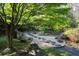 Beautifully landscaped garden with stone pathway and lush greenery at 4615 Northside Dr, Atlanta, GA 30327