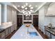Bright kitchen showcasing a center island with seating, and custom cabinets with gold hardware at 4615 Northside Dr, Atlanta, GA 30327