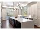 Spacious kitchen with a large island, modern lighting, and stainless steel appliances at 4615 Northside Dr, Atlanta, GA 30327