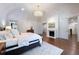 Relaxing primary bedroom with a fireplace, chandelier, and hardwood flooring at 4615 Northside Dr, Atlanta, GA 30327