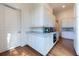 Well-lit pantry with white cabinets, marble countertop and stainless steel appliances at 4615 Northside Dr, Atlanta, GA 30327