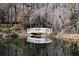 Picturesque pond with a white bridge creates a tranquil setting for enjoying nature and peaceful reflections at 4615 Northside Dr, Atlanta, GA 30327