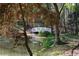 A white bridge adds charm to this outdoor space, crossing over the serene pond at 4615 Northside Dr, Atlanta, GA 30327