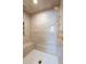Shower featuring gold hardware, patterned tile and a built-in bench at 4615 Northside Dr, Atlanta, GA 30327