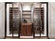 Wine cellar with glass-enclosed storage, and wood cabinetry at 4615 Northside Dr, Atlanta, GA 30327