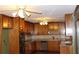 Functional kitchen featuring wooden cabinets, tile backsplash, and stainless steel appliances at 1655 Old Salem Rd, Covington, GA 30013