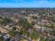 Aerial community view nestled amongst mature trees with a skyline in the distance at 1890 Carla Dr, Morrow, GA 30260