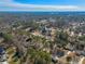 This aerial view shows a community surrounded by many mature trees at 1890 Carla Dr, Morrow, GA 30260