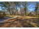 Backyard with mature trees and grassy area at 1890 Carla Dr, Morrow, GA 30260