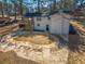 This backyard features an elevated porch and a stone walkway to the back entrance at 1890 Carla Dr, Morrow, GA 30260