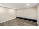 Basement area featuring wood-look floors, recessed lighting, and a dark accent bench at 1890 Carla Dr, Morrow, GA 30260