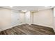 Basement area with wood-look flooring, recessed lighting, and two white doors at 1890 Carla Dr, Morrow, GA 30260