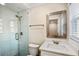 Bathroom featuring walk-in shower with glass doors, and bright natural light at 1890 Carla Dr, Morrow, GA 30260