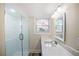 Bathroom featuring a glass-enclosed shower and a modern vanity with a sleek countertop at 1890 Carla Dr, Morrow, GA 30260