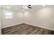 Bedroom with ceiling fan and wood-look flooring at 1890 Carla Dr, Morrow, GA 30260