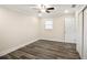 Bright bedroom with hardwood floors, ceiling fan, and closet at 1890 Carla Dr, Morrow, GA 30260