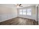 Bright dining room featuring wood floors, a ceiling fan, and wainscoting at 1890 Carla Dr, Morrow, GA 30260